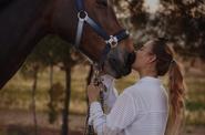 Woman getting acquainted with a horse 