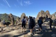 rocky mountain with tourists