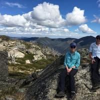 tourists in mountains in clouds